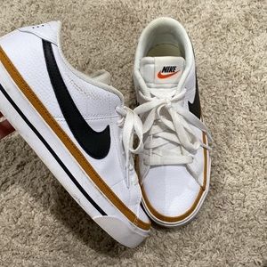 White and black Nike low top blazers
